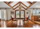 Cozy dining area with beautiful hardwood floors, exposed beams, and charming chandelier at 4531 Montibello Dr, Charlotte, NC 28226