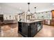 Large kitchen island with a view of the living room and many cabinets for storage at 4531 Montibello Dr, Charlotte, NC 28226