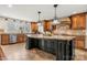 Gourmet kitchen with custom island, granite countertops, and stainless steel appliances at 4531 Montibello Dr, Charlotte, NC 28226