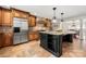 Open kitchen design with large island, stainless steel appliances, and eat-in bar at 4531 Montibello Dr, Charlotte, NC 28226
