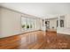 Spacious living room with hardwood floors, large windows, and classic architectural details and natural light at 4531 Montibello Dr, Charlotte, NC 28226