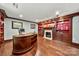 A well-appointed office with a fireplace, custom built-ins, and hardwood flooring at 4531 Montibello Dr, Charlotte, NC 28226