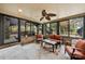 Relaxing sun room with ceiling fan and view of the garden at 4531 Montibello Dr, Charlotte, NC 28226