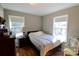 Comfortable bedroom featuring hardwood floors, neutral walls, and natural light at 508 Bessemer City Rd, Gastonia, NC 28052