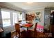 Cozy dining area featuring a round table, hardwood floors, and a bright window at 508 Bessemer City Rd, Gastonia, NC 28052