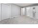 A serene bedroom features plush carpeting, ample closet space, and an ensuite bathroom for added convenience at 5329 Southampton Rd, Charlotte, NC 28217