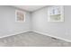 Bright bedroom with neutral paint, plush carpet, and natural light streaming through the windows at 5329 Southampton Rd, Charlotte, NC 28217