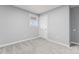 Inviting bedroom with neutral walls, plush carpet, and a bright window, perfect for relaxation at 5329 Southampton Rd, Charlotte, NC 28217