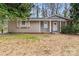 Charming single-story home featuring neutral siding, a new roof, and a well-maintained front lawn at 5329 Southampton Rd, Charlotte, NC 28217