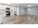 Renovated kitchen with stainless steel appliances, sleek white cabinets, and modern finishes at 5329 Southampton Rd, Charlotte, NC 28217