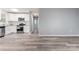 Open-concept kitchen featuring new appliances, granite countertops, and luxury vinyl flooring at 5329 Southampton Rd, Charlotte, NC 28217