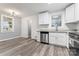 Updated kitchen boasts stainless steel appliances, granite countertops, and new flooring at 5329 Southampton Rd, Charlotte, NC 28217