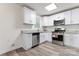 Bright kitchen features white cabinets, stainless steel appliances, and granite countertops at 5329 Southampton Rd, Charlotte, NC 28217