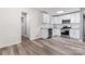 Modern kitchen featuring stainless appliances, granite counters, and new flooring at 5329 Southampton Rd, Charlotte, NC 28217
