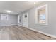 Spacious open-concept living room featuring new flooring, fresh paint, and natural lighting at 5329 Southampton Rd, Charlotte, NC 28217