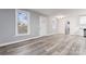 Open-concept living space with new flooring throughout, connecting living and kitchen areas at 5329 Southampton Rd, Charlotte, NC 28217
