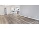 Bright, open living space featuring fresh paint, LVP flooring, and a modern kitchen at 5329 Southampton Rd, Charlotte, NC 28217