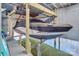Well-equipped boat house with a boat lift system, ensuring easy access and secure storage for watercraft at 547 Lake Shore Dr, Norwood, NC 28128