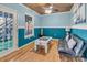 Bonus room featuring a foosball table, couch and outside access to the house at 547 Lake Shore Dr, Norwood, NC 28128