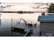 Wide view of dock on water with seating, a slide and clear water view on a sunny day at 547 Lake Shore Dr, Norwood, NC 28128