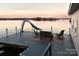 Dock on the water featuring lake access and a seating area and slide for enjoying lake activities at 547 Lake Shore Dr, Norwood, NC 28128
