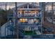 Multi-level lake house featuring expansive decks and charming outdoor living spaces with serene wooded views at 547 Lake Shore Dr, Norwood, NC 28128