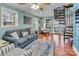 Bright living room features a spiral staircase, hardwood floors, and water views at 547 Lake Shore Dr, Norwood, NC 28128