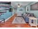 Comfortable living room showcases a nautical theme and spiral staircase at 547 Lake Shore Dr, Norwood, NC 28128