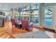 Cozy living room with hardwood floors, lake views, comfortable seating, and easy access to the porch at 547 Lake Shore Dr, Norwood, NC 28128