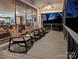 Spacious patio features rocking chairs, and views of the outside at 547 Lake Shore Dr, Norwood, NC 28128