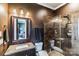 Bathroom with walk-in shower, marble vanity, and stylish lighting at 5628 Creole Rd, Clover, SC 29710