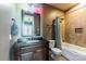 Well-lit bathroom with a tub-shower combo, vanity with dark cabinets, neutral colored tile and a toilet at 5628 Creole Rd, Clover, SC 29710