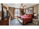 Comfortable bedroom with a wooden bed frame, ceiling fan, window letting in natural light, and neutral walls at 5628 Creole Rd, Clover, SC 29710