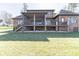 Brick home with a finished basement, large screened in back porch, and ample yard space on a sunny day at 5628 Creole Rd, Clover, SC 29710