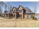 This beautiful brick home features unique architectural design, beautiful landscaping, and lake at 5628 Creole Rd, Clover, SC 29710