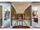 View from the top of the stairs of the foyer with decorative front door and chandelier at 5628 Creole Rd, Clover, SC 29710