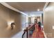 Hallway with hardwood floors and decorative wall sconce at 5628 Creole Rd, Clover, SC 29710