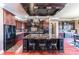 A spacious kitchen features a large island with seating, dark wood cabinets, and modern appliances at 5628 Creole Rd, Clover, SC 29710
