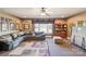 Spacious living room with comfortable seating, neutral walls, ceiling fan and a large window providing plenty of light at 5628 Creole Rd, Clover, SC 29710