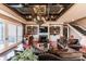 The living room showcases custom shelving, coffered ceiling, and backyard access at 5628 Creole Rd, Clover, SC 29710