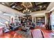 The living room features a coffered ceiling and flows into the kitchen and dining area at 5628 Creole Rd, Clover, SC 29710