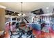 A stunning open concept space has the kitchen, dining, and living rooms visible with beautiful chandeliers at 5628 Creole Rd, Clover, SC 29710