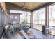 Comfortable screened porch with lake views, with ample seating and ceiling fan for relaxing and entertaining at 5628 Creole Rd, Clover, SC 29710