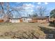 Spacious backyard featuring a deck, outbuilding, and privacy fence at 602 Charles Rd, Shelby, NC 28152
