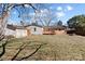 Backyard with a storage shed, wood deck, and mature trees at 602 Charles Rd, Shelby, NC 28152