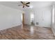 This bedroom features hardwood floors, a ceiling fan and bright white walls at 602 Charles Rd, Shelby, NC 28152