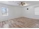 Bright bedroom featuring hardwood floors, ceiling fan and window bringing in natural light at 602 Charles Rd, Shelby, NC 28152