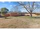 Single story brick home with a covered carport and mature trees at 602 Charles Rd, Shelby, NC 28152