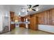 Large kitchen with wood paneling, white appliances, and tile flooring at 602 Charles Rd, Shelby, NC 28152
