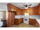 The kitchen features wood cabinets, white appliances, and ample counter space at 602 Charles Rd, Shelby, NC 28152